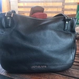 Never been used Michael Kors black leather purse.